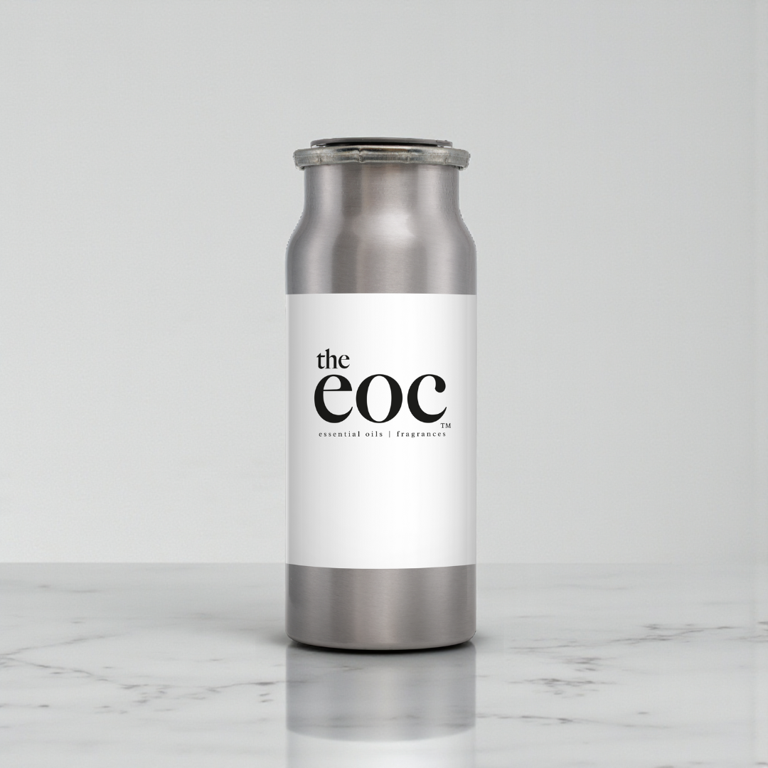 Silver and white bottle with 'the eoc' label on a marble surface