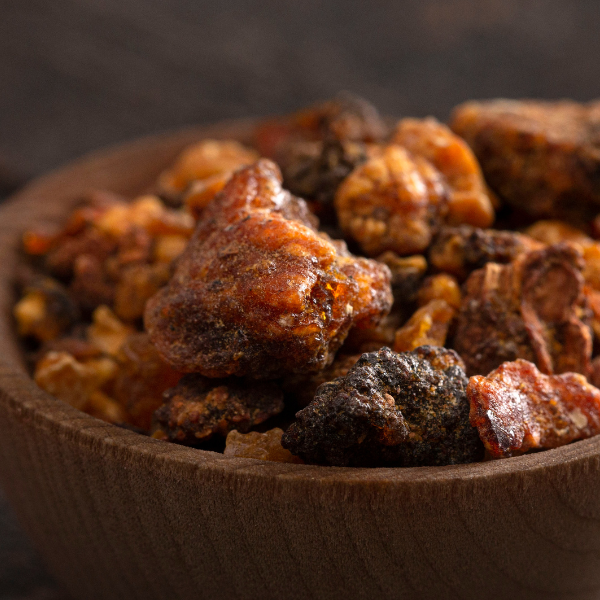 Close-up of Frankincense in a wooden bowl with a blurred background